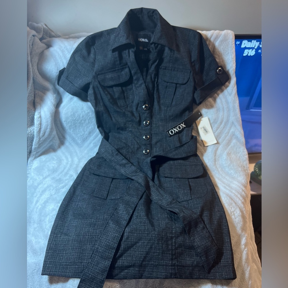 Professional military button half way down belted dress. Brand new with tags.